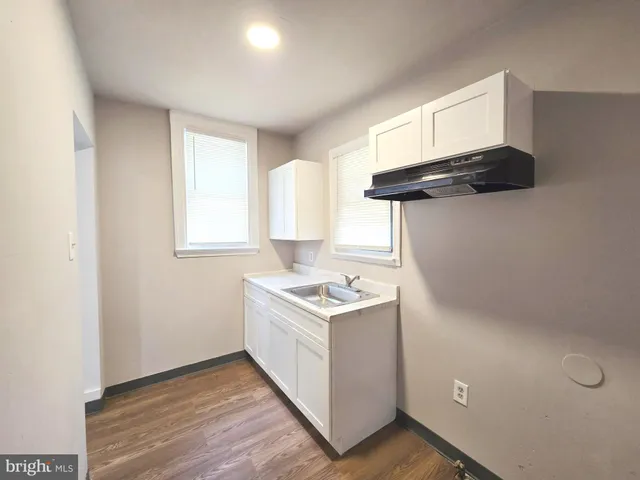 a kitchen with a stove and a cabinet
