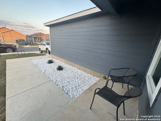 a balcony view with a couch and table