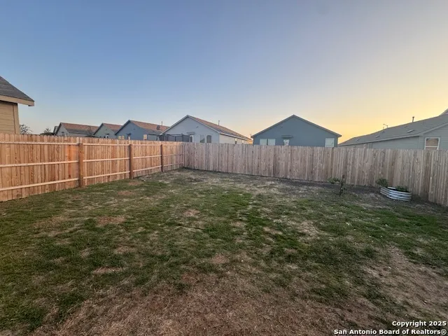 a view of a back yard of the house
