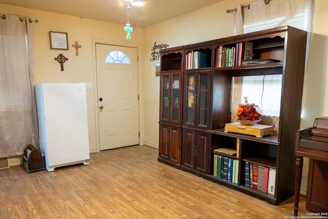 a view of room with furniture and wooden floor