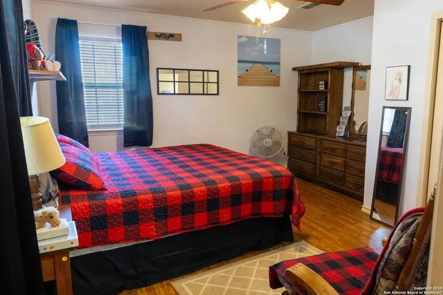 a bedroom with a bed closet and flat tv screen