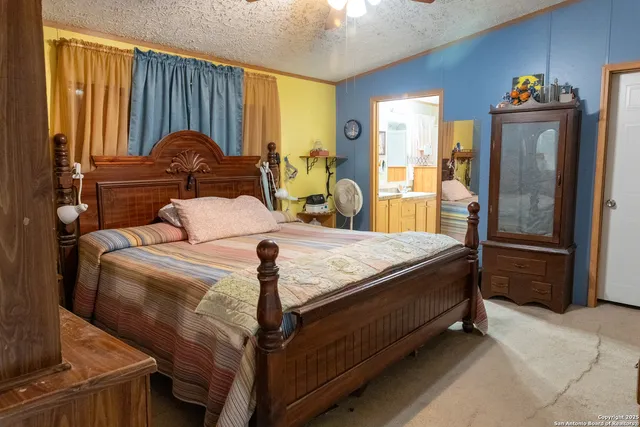 a bed sitting in a room next to a window