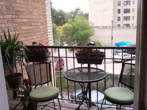 6954 North Greenview Avenue, Unit 305 Chicago, IL 60626 - Photo 12 of 12 a view of a chairs and table in patio