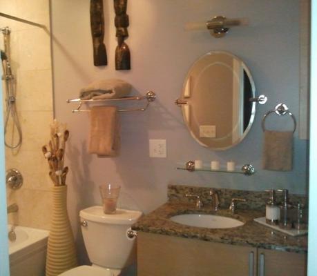 6954 North Greenview Avenue, Unit 305 Chicago, IL 60626 - Photo 5 of 12 a bathroom with a granite countertop toilet sink and mirror