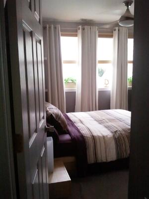6954 North Greenview Avenue, Unit 305 Chicago, IL 60626 - Photo 6 of 12 a bedroom with a bed and window