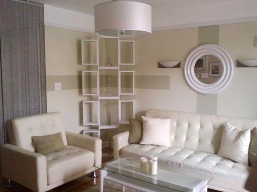 6954 North Greenview Avenue, Unit 305 Chicago, IL 60626 - Photo 10 of 12 a living room with furniture and a window