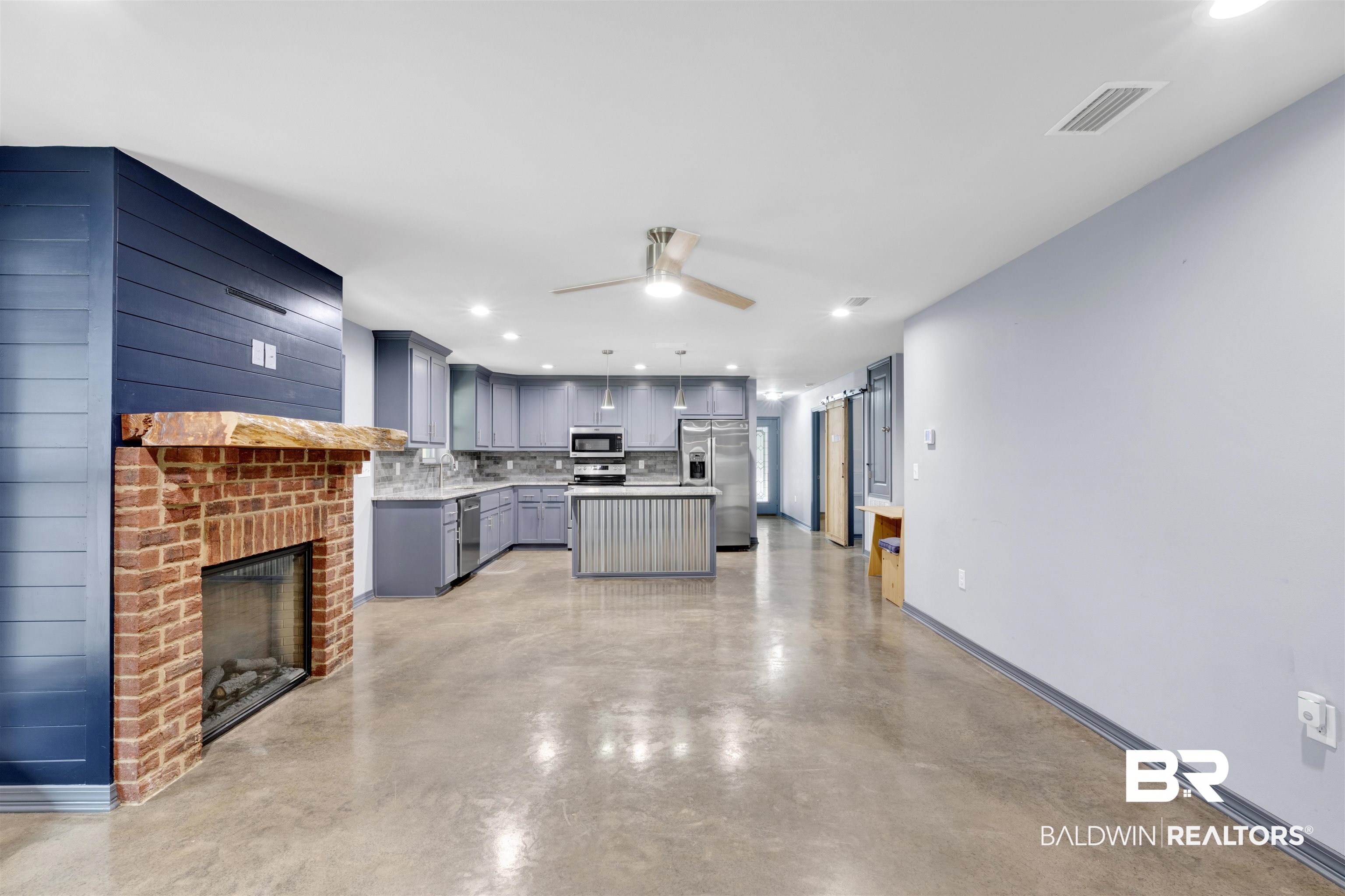 36397 Alexandria Trail Stapleton, AL 36578 - Photo 63 of 65 Kitchen with finished concrete floors, open floor plan, a center island, recessed lighting, and gray cabinetry