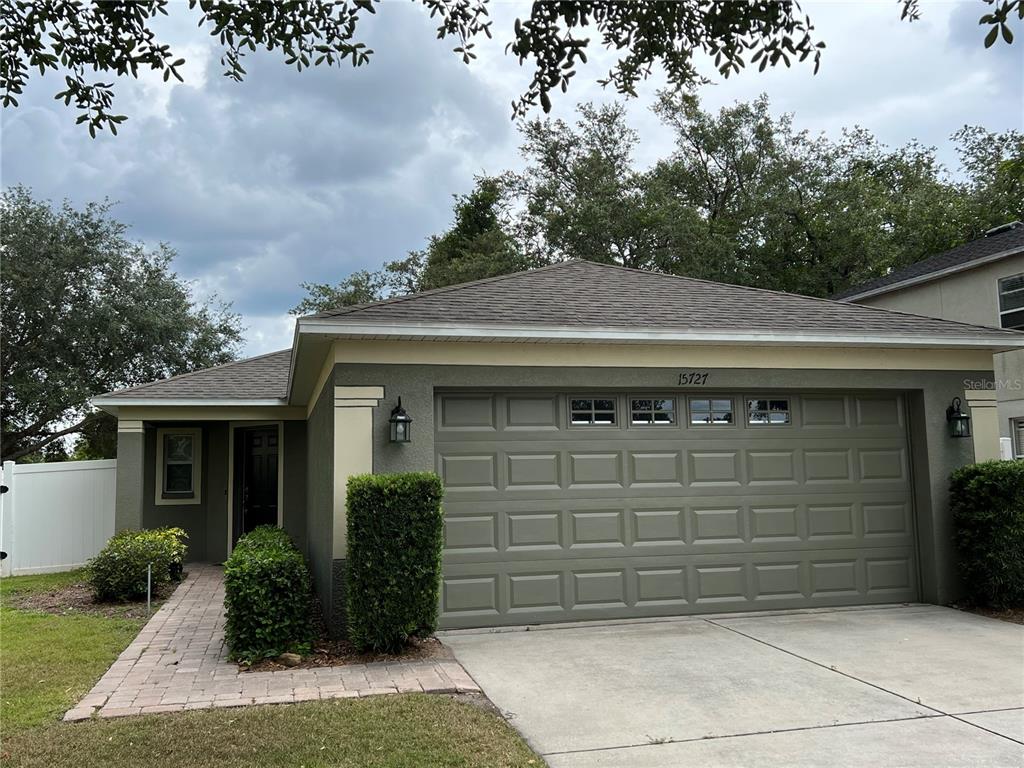 a front view of a house with garage