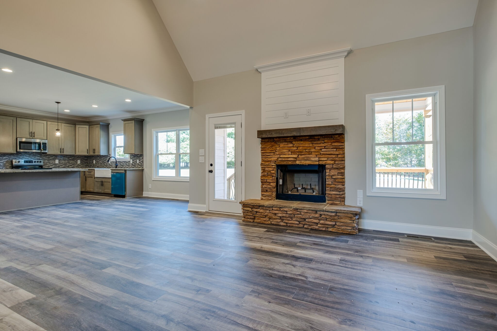 553 Cedar Grove Road Lebanon, TN 37087 - Photo 8 of 12 a view of an empty room with a kitchen and fireplace