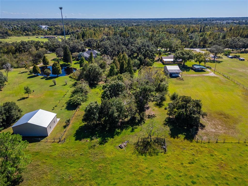 6930 Muck Pond Road Seffner, FL 33584 - Photo 24 of 37 a view of a lake with houses