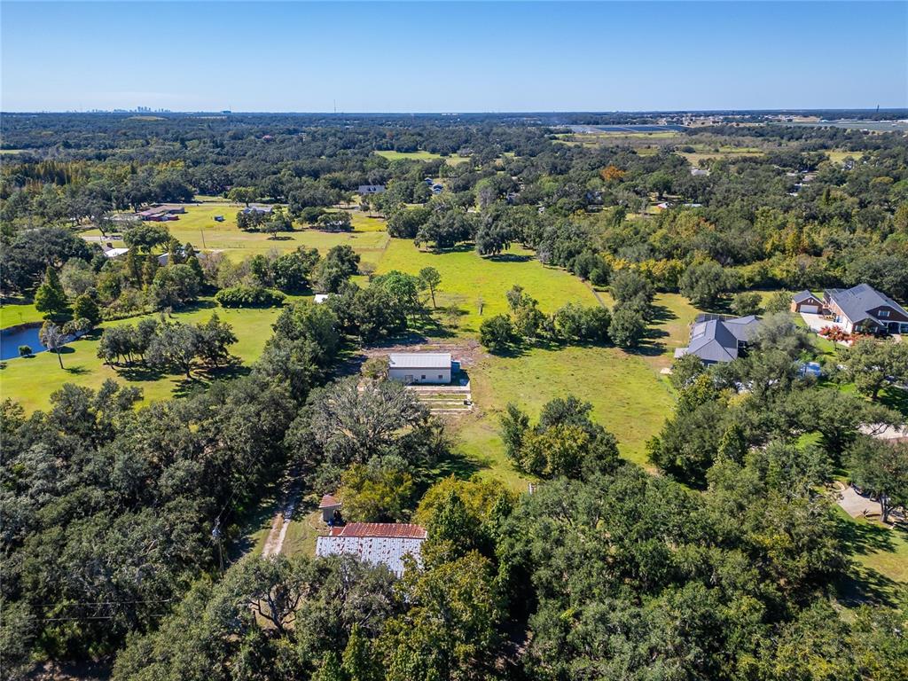 6930 Muck Pond Road Seffner, FL 33584 - Photo 28 of 37 an aerial view of residential houses with outdoor space and lake view