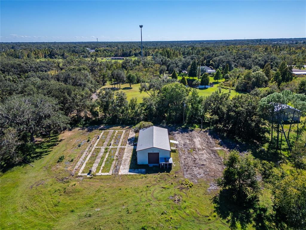 6930 Muck Pond Road Seffner, FL 33584 - Photo 29 of 37 an aerial view of a house with a yard