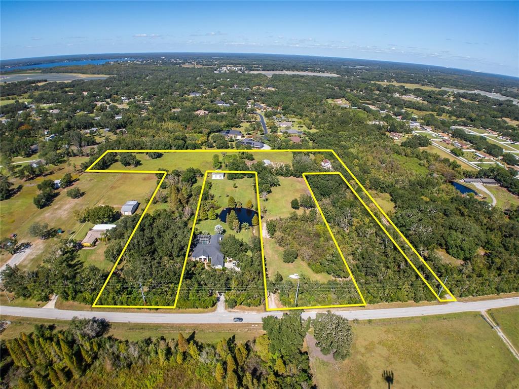 6930 Muck Pond Road Seffner, FL 33584 - Photo 8 of 37 an aerial view of residential houses with outdoor space