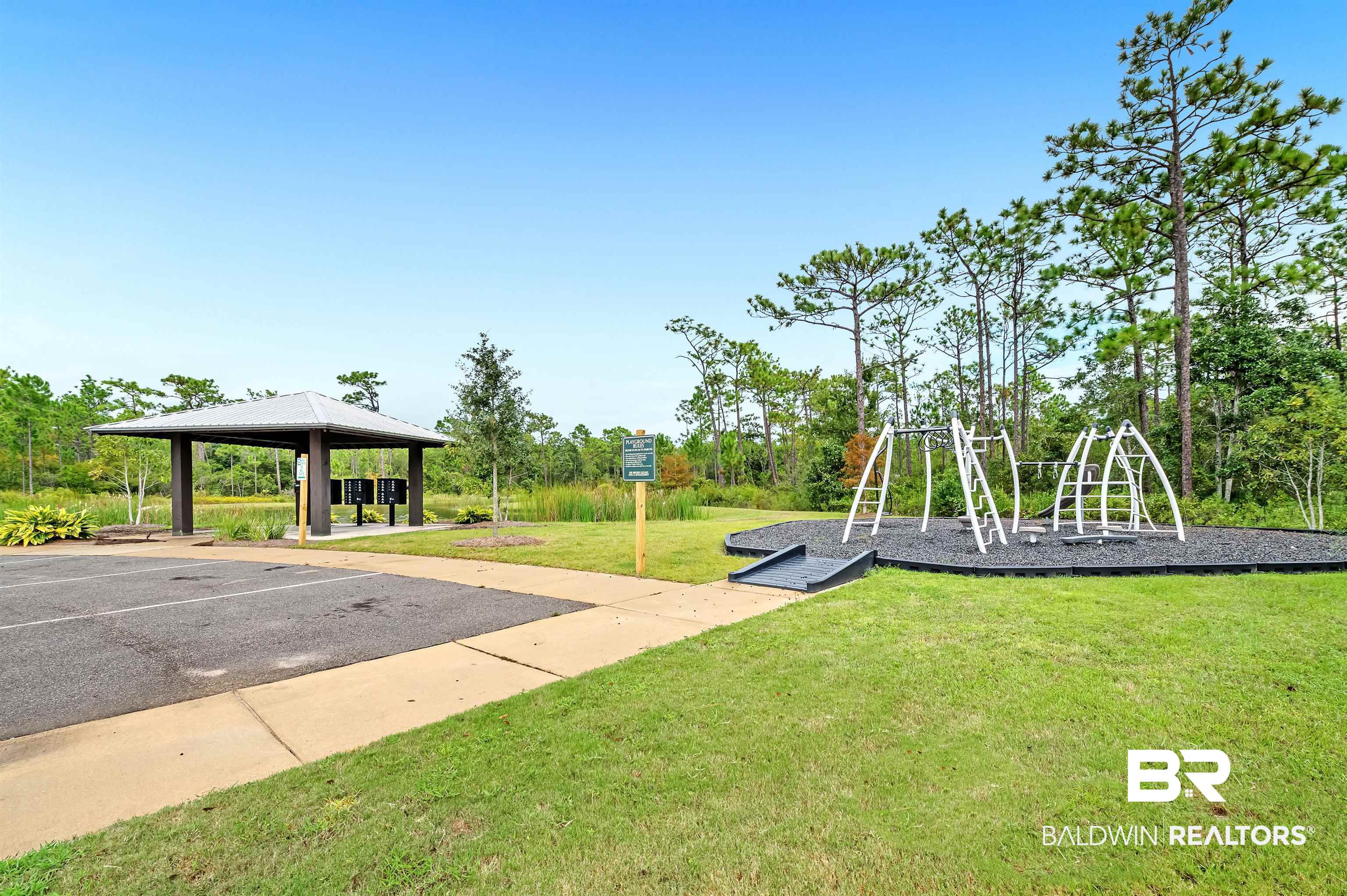 24549 Broken Sound Loop Orange Beach, AL 36561 - Photo 42 of 57 View of play area featuring a gazebo and a yard
