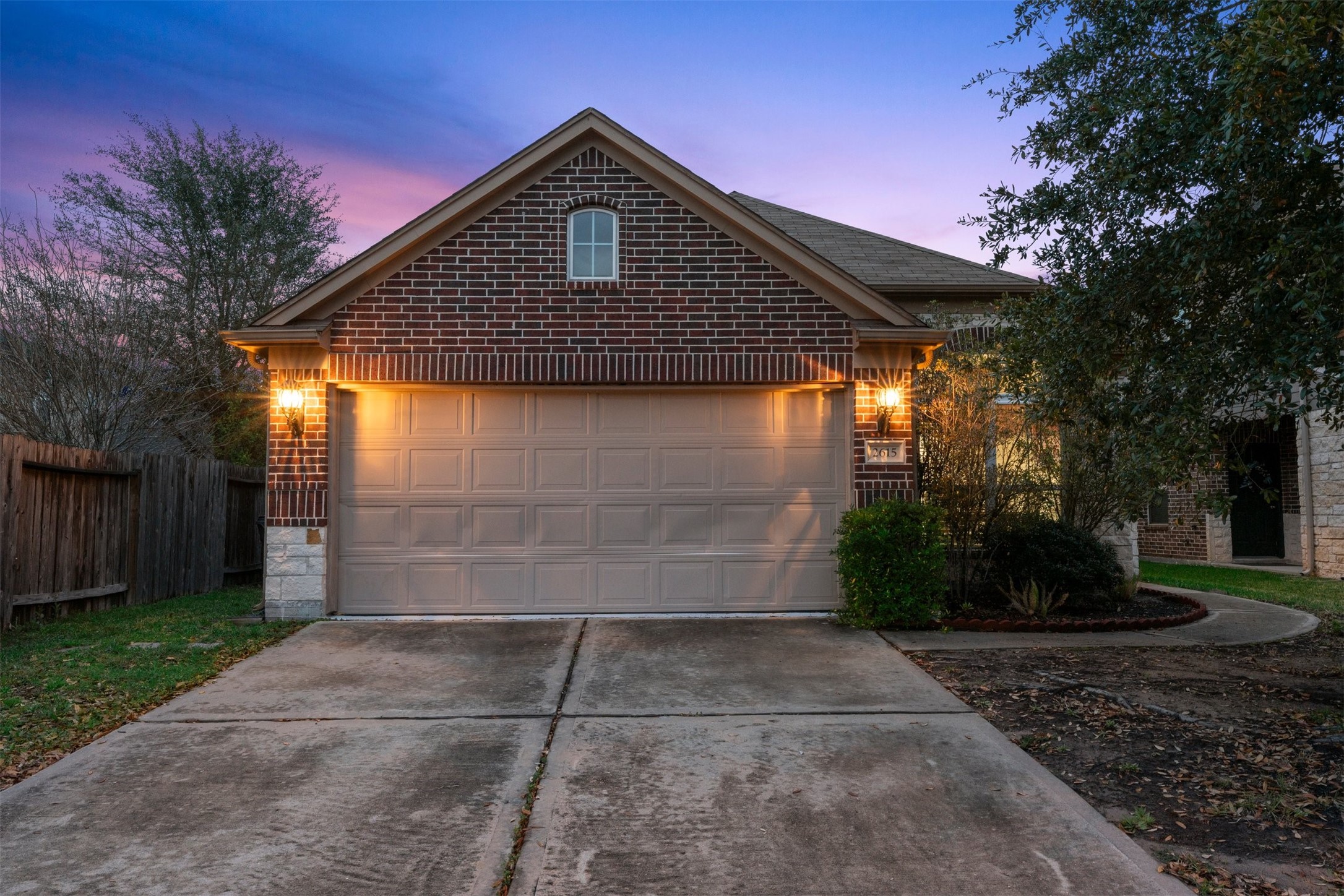 2615 Magnolia Fair Way Spring, TX 77386 - Photo 1 of 22 a front view of a house with a yard
