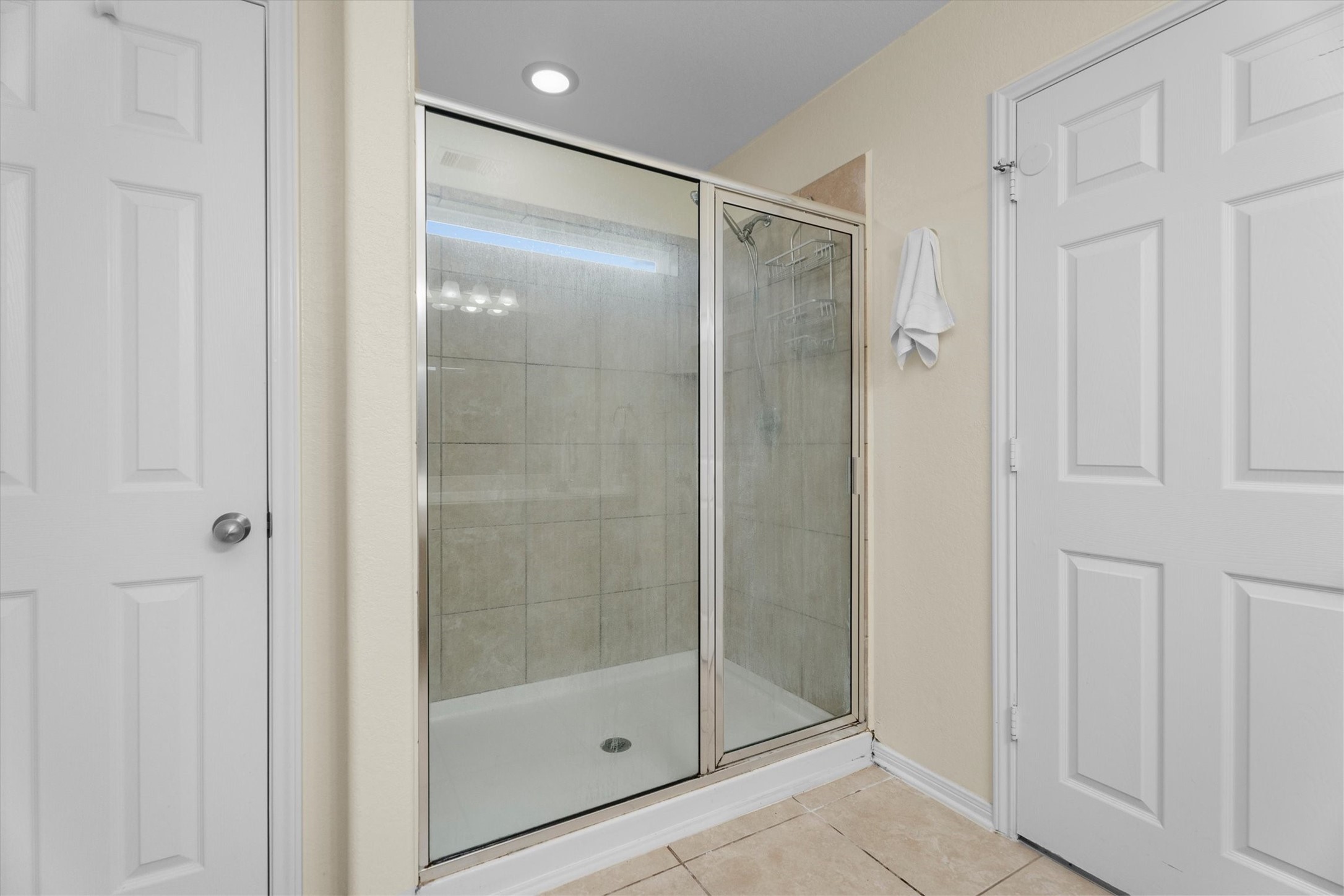 2615 Magnolia Fair Way Spring, TX 77386 - Photo 14 of 22 a bathroom with a glass shower door