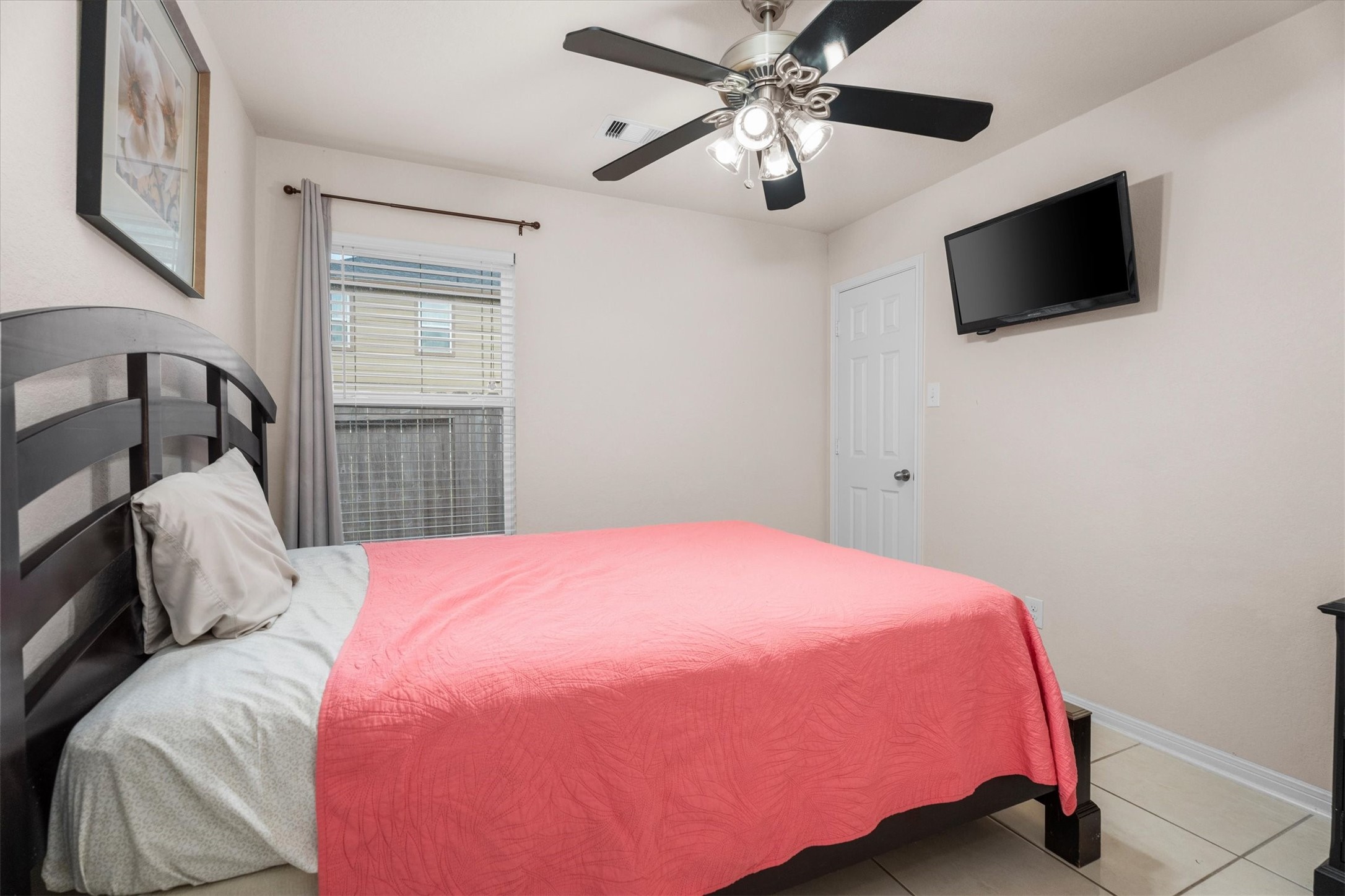 2615 Magnolia Fair Way Spring, TX 77386 - Photo 19 of 22 a bedroom with a bed and a flat screen tv