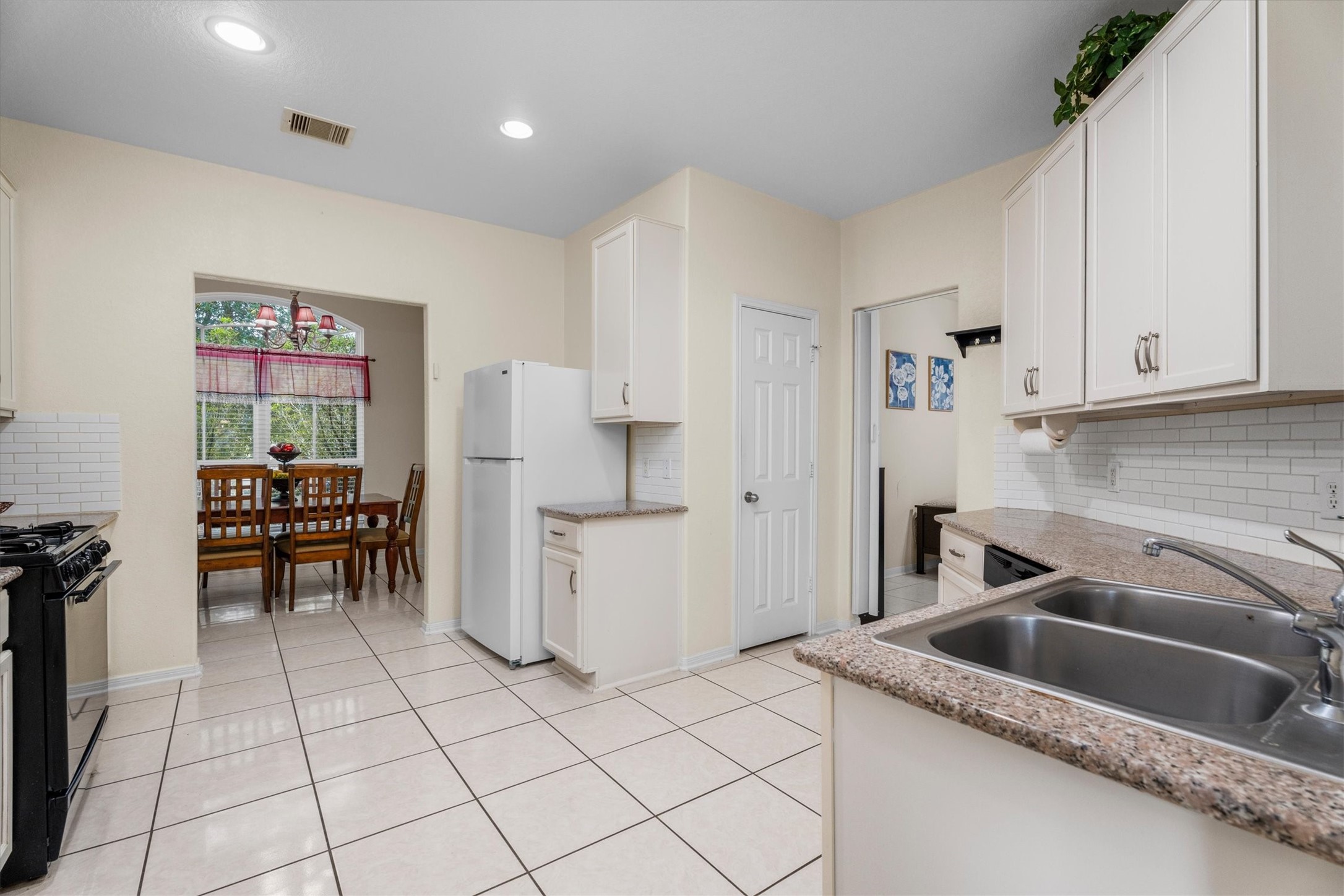 2615 Magnolia Fair Way Spring, TX 77386 - Photo 7 of 22 a kitchen that has a refrigerator and a sink