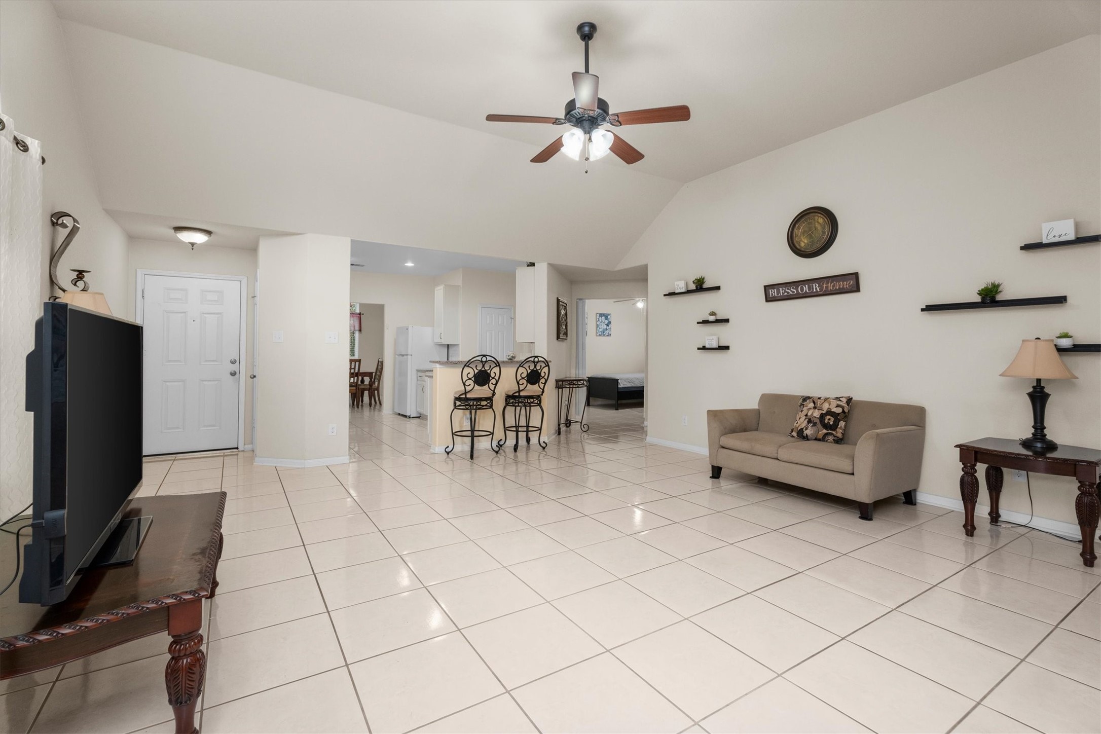 2615 Magnolia Fair Way Spring, TX 77386 - Photo 10 of 22 a living room with furniture and a flat screen tv