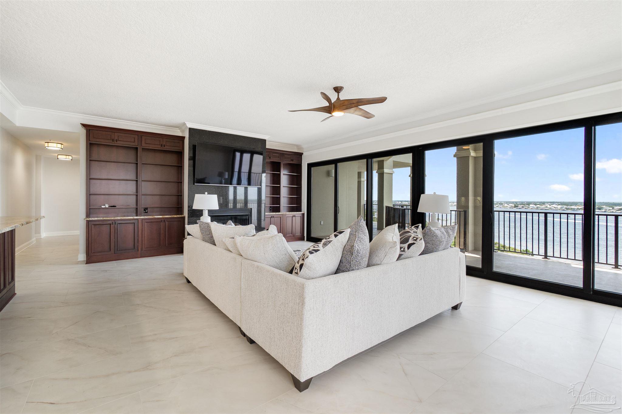 14900 River Road, Unit 904 Pensacola, FL 32507 - Photo 4 of 17 a living room with furniture and a large window