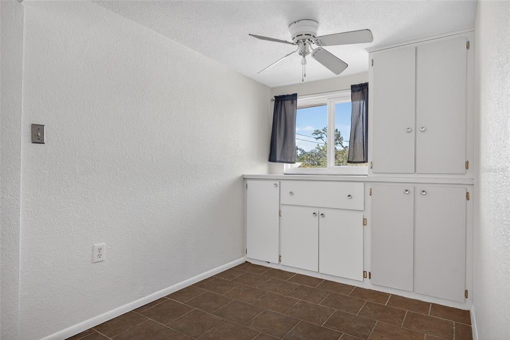 2136 Barksdale Street Port Charlotte, FL 33948 - Photo 13 of 33 a view of cabinets with wooden floor