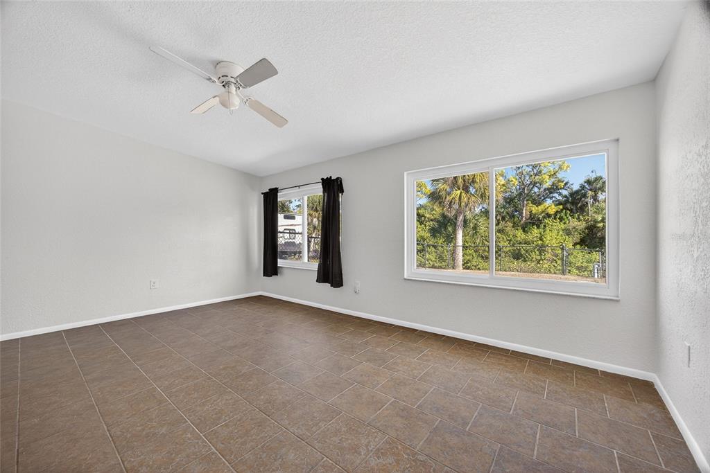 2136 Barksdale Street Port Charlotte, FL 33948 - Photo 15 of 33 an empty room with windows