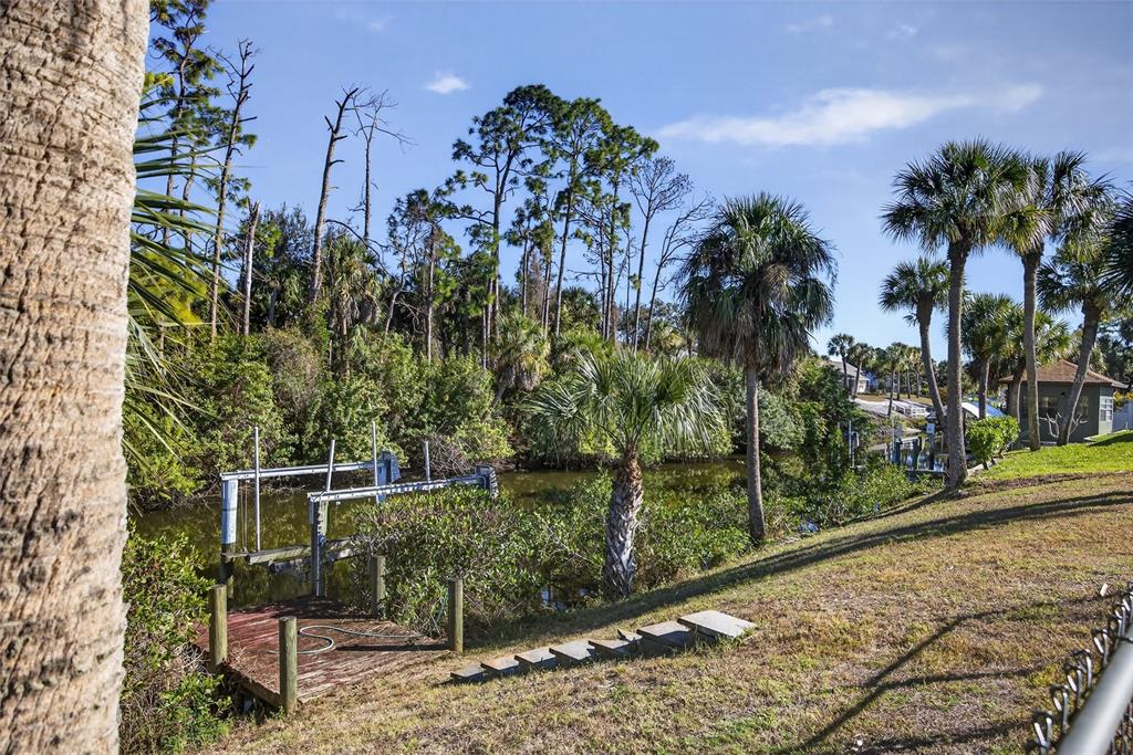 2136 Barksdale Street Port Charlotte, FL 33948 - Photo 2 of 33 a backyard of a house with lots of green space