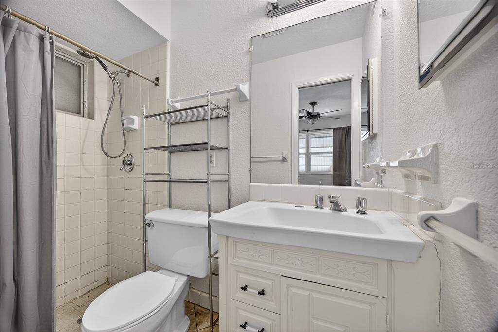 2136 Barksdale Street Port Charlotte, FL 33948 - Photo 21 of 33 a bathroom with a sink toilet vanity and shower