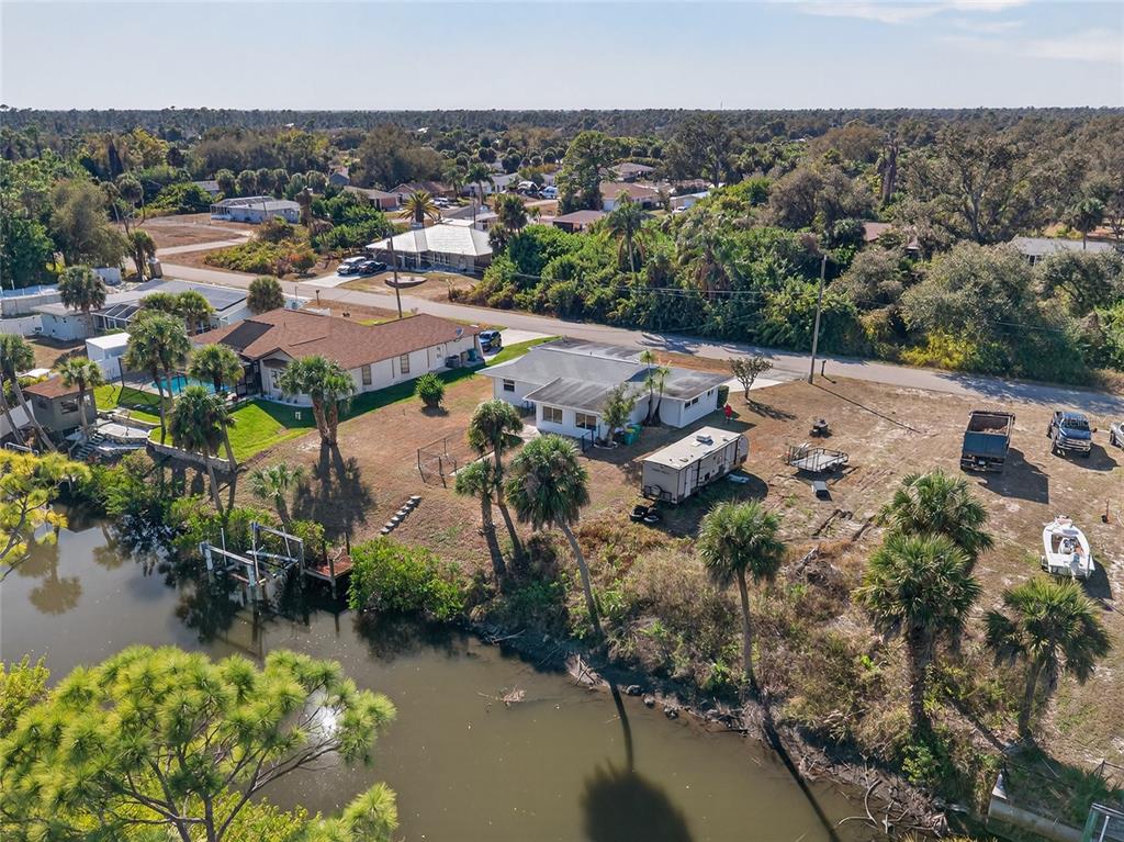 2136 Barksdale Street Port Charlotte, FL 33948 - Photo 28 of 33 an aerial view of residential houses with outdoor space and lake view