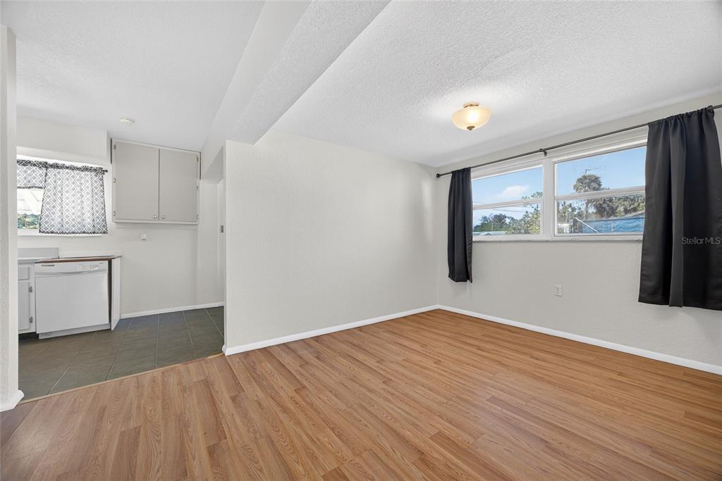 2136 Barksdale Street Port Charlotte, FL 33948 - Photo 8 of 33 a view of empty room with wooden floor and window