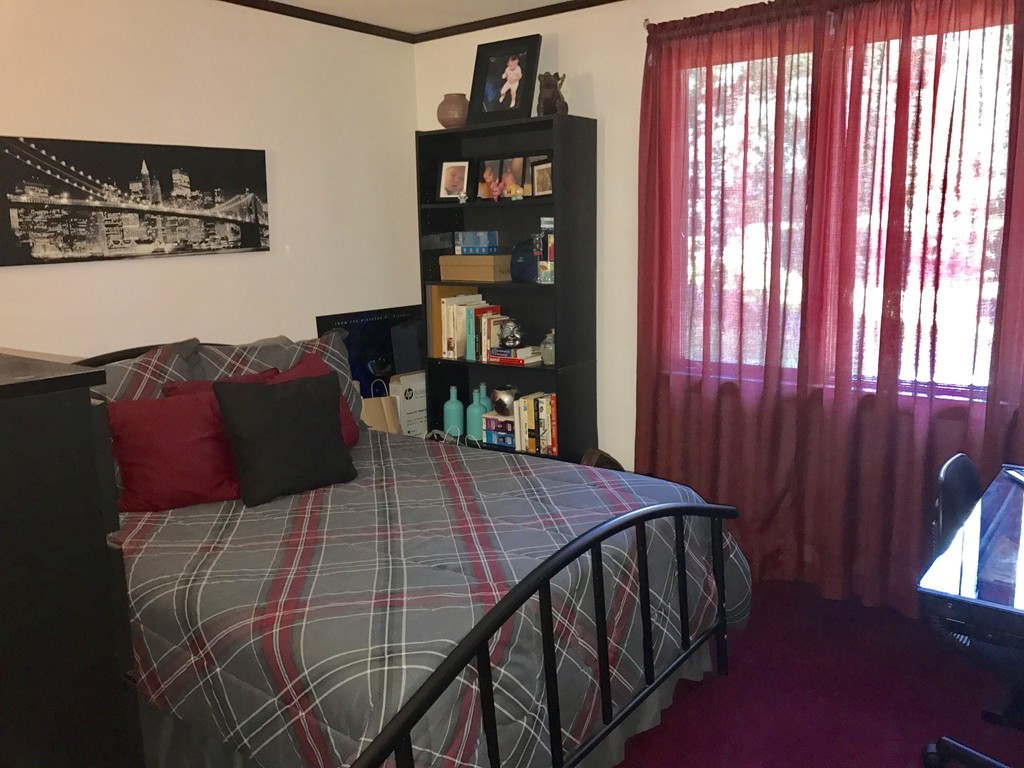 7 Van Beal Road Randolph, MA 02368 - Photo 12 of 22 a bedroom with a bed and a window