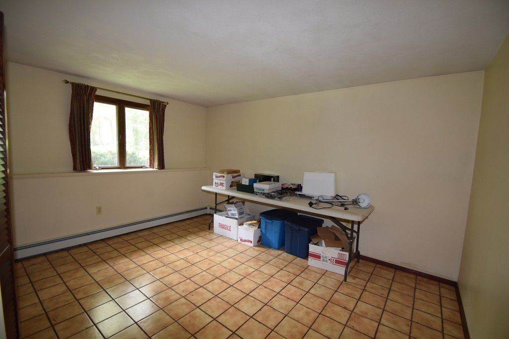 7 Van Beal Road Randolph, MA 02368 - Photo 13 of 22 a view of a workspace with furniture and a window