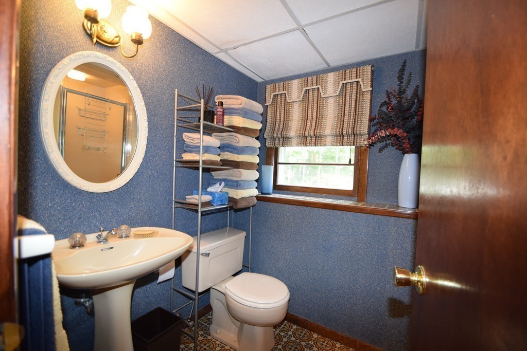 7 Van Beal Road Randolph, MA 02368 - Photo 17 of 22 a bathroom with a sink a toilet and a mirror