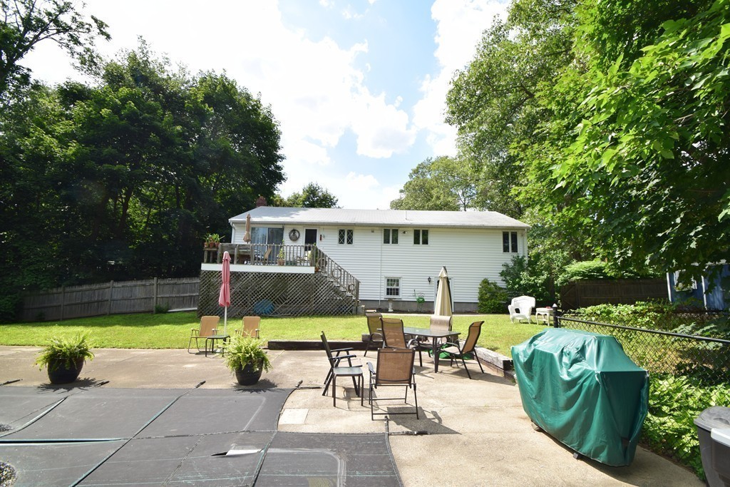 7 Van Beal Road Randolph, MA 02368 - Photo 19 of 22 a view of a house with backyard sitting area and swimming pool