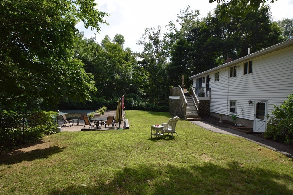 7 Van Beal Road Randolph, MA 02368 - Photo 20 of 22 a view of a house with backyard and sitting area