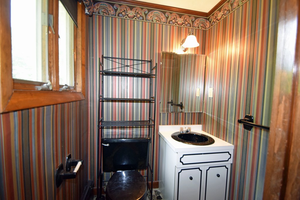 7 Van Beal Road Randolph, MA 02368 - Photo 10 of 22 a bathroom with a sink and washing machine