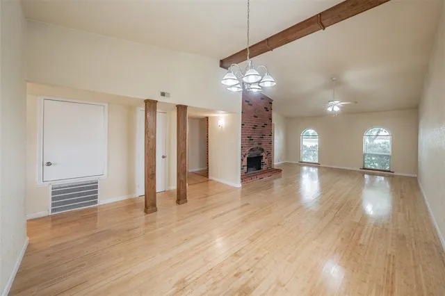 a view of a livingroom with a furniture wooden floor and window