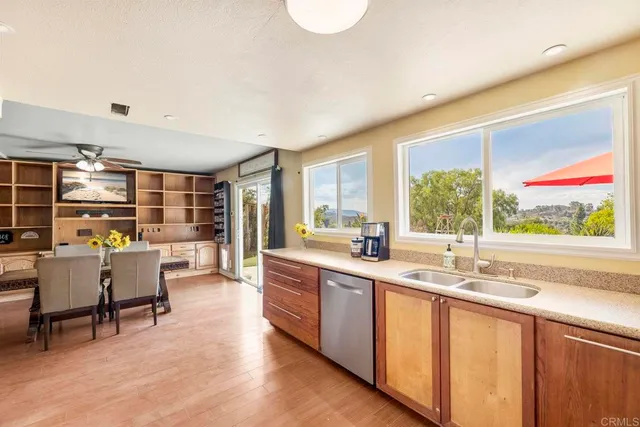 a kitchen with stainless steel appliances granite countertop a stove and a sink