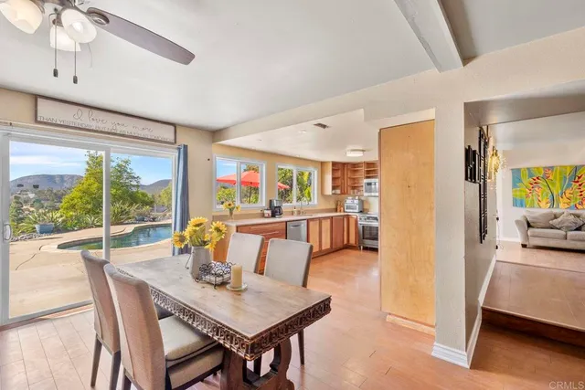 a view of a backyard with a patio and fire pit