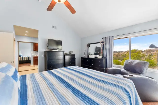 a bathroom with a double vanity sink a mirror and a bathtub