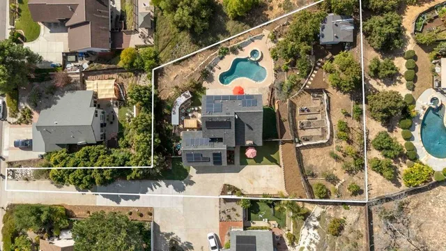 an aerial view of residential house and green space