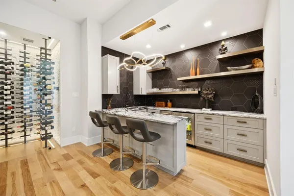 a kitchen with a table and chairs in it