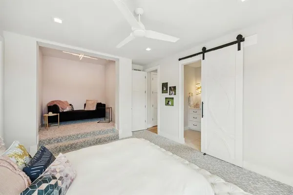a bedroom with a bed and a walk in closet