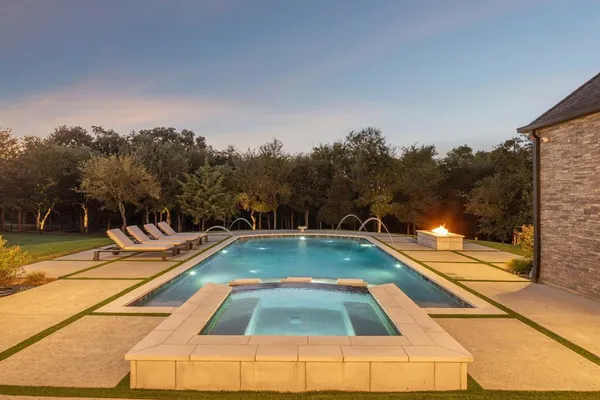 a view of swimming pool with chairs