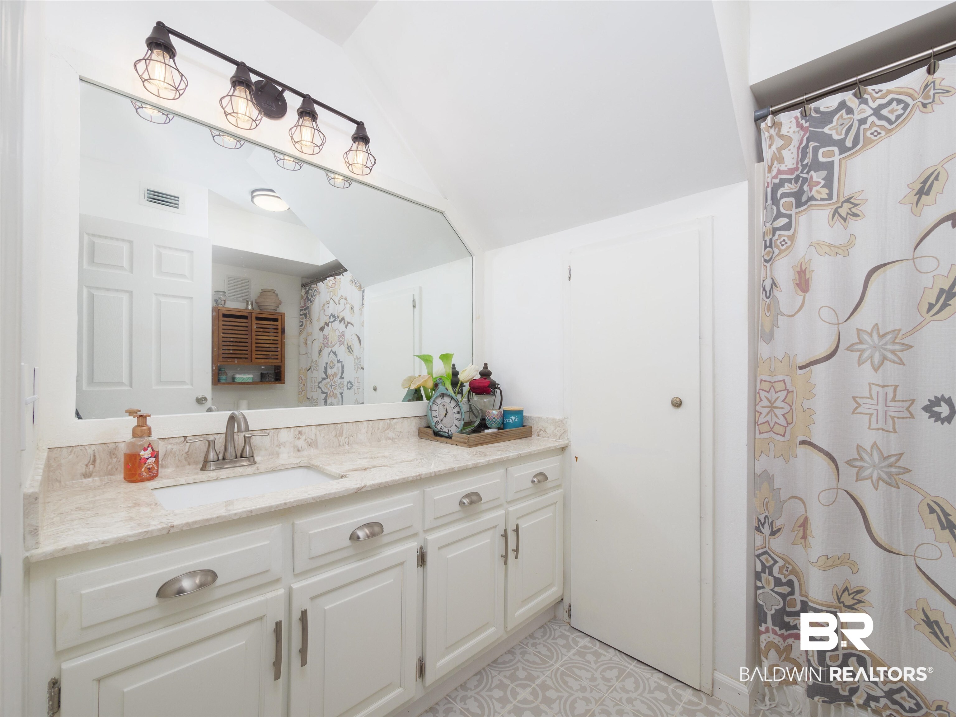 494 Ridgewood Drive Daphne, AL 36526 - Photo 18 of 40 Bathroom with vanity and vaulted ceiling