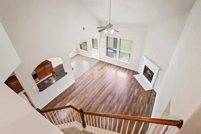 a view of a workspace with wooden floor
