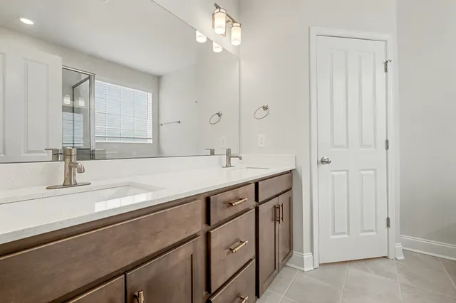 a bathroom with a sink a vanity and a mirror