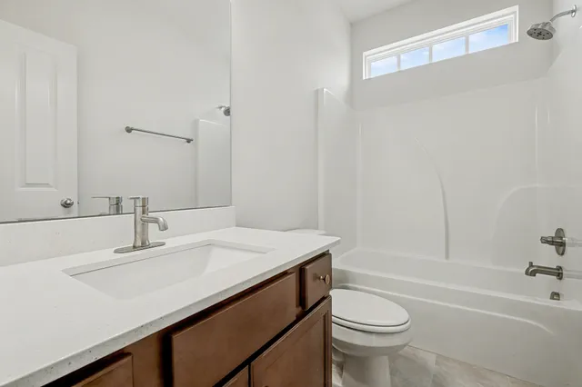 a bathroom with a sink a toilet and a bathtub