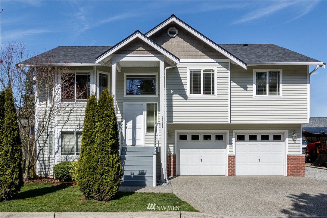 7432 Upper Ridge Road Everett, WA 98203 - Photo 1 of 32 a front view of a house with a yard