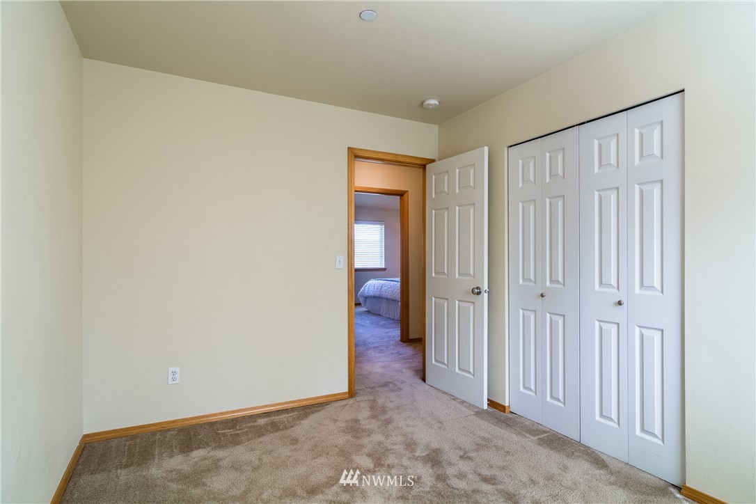7432 Upper Ridge Road Everett, WA 98203 - Photo 17 of 32 a view of a hallway with wooden floor
